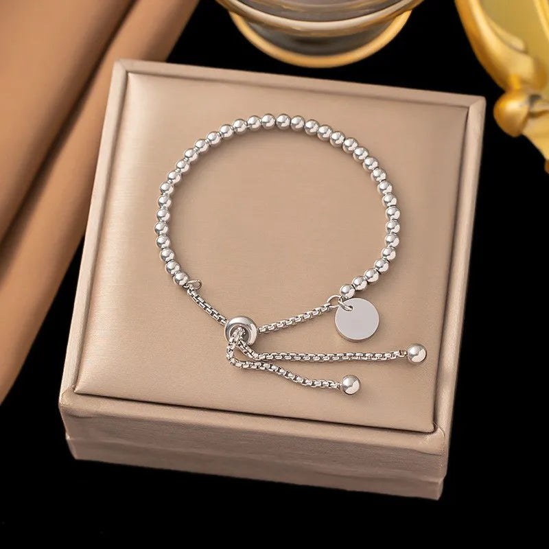 ANENJERY 316L Stainless Small Ball Beads Pull Out Bracelet for Women Simple Fashion Circular Tag Bracelet Daily Party Jewelry